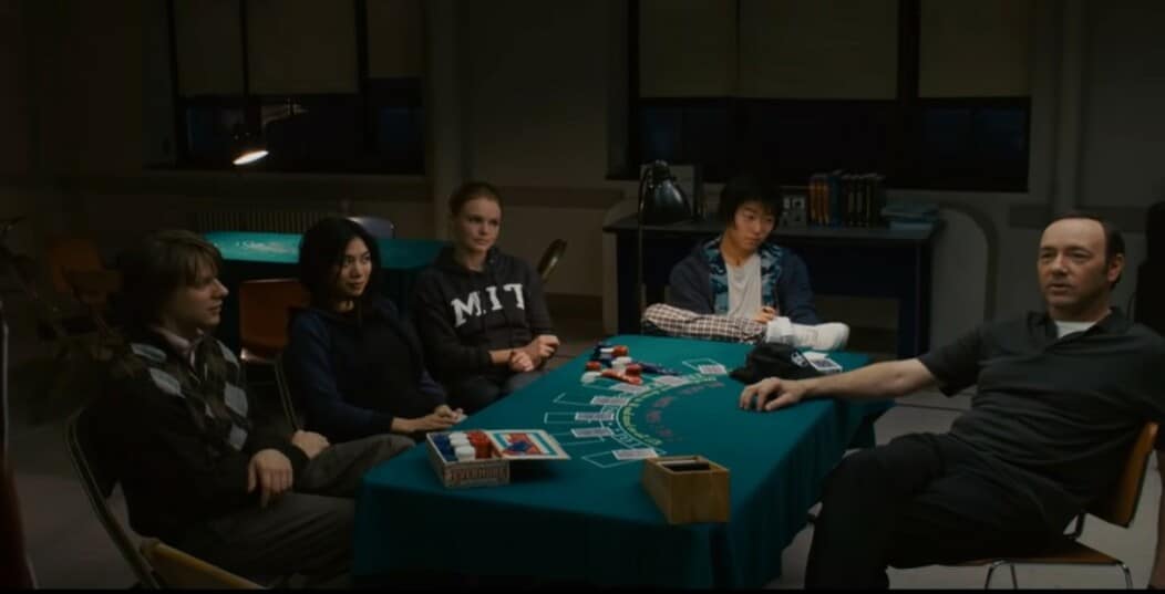 21 casino movie scene with the five main characters sitting at a blackjack table