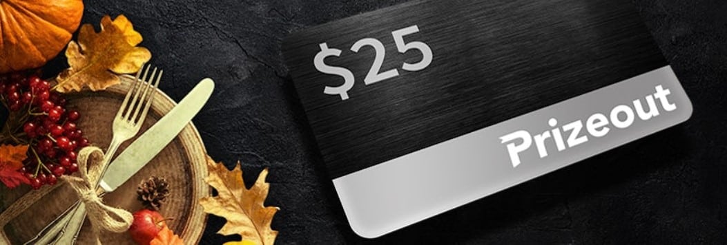 PlayStar Thanksgiving casino promotion $25 prizeout gift card on a black table with Thanksgiving dish on the left side