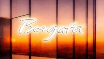 Borgata text over a background picturing a sunset view from a window