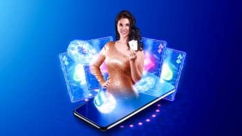 Woman holding two playing cards coming out of a mobile phone, in front of a hand of cards, on a blue background